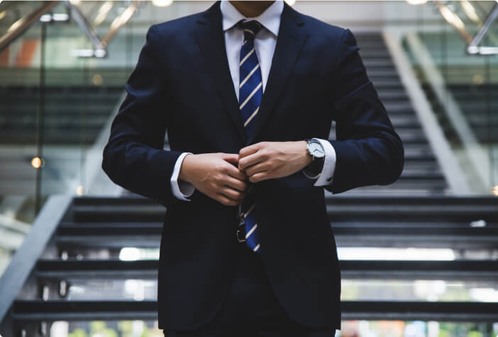 Financial services banking sales professional wearing a black suit