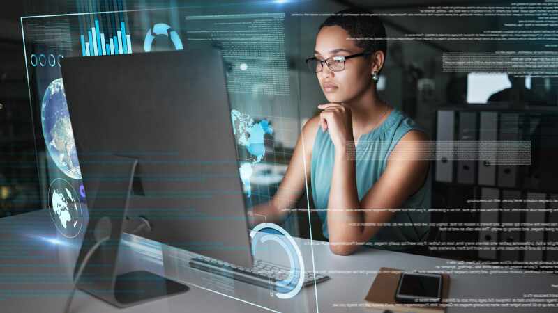 Salesperson at computer using insurance sales technology