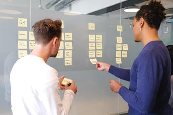 two sales leaders planning sales compensation strategies