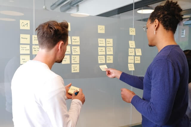 two sales leaders planning sales compensation strategies