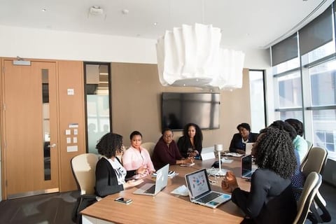 Corporate meeting of sales leaders deciding on a sales performance management software