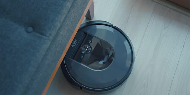 irobot roomba going under table