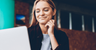 smiling female using ai for sales reporting