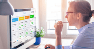 female comp analyst using sales software